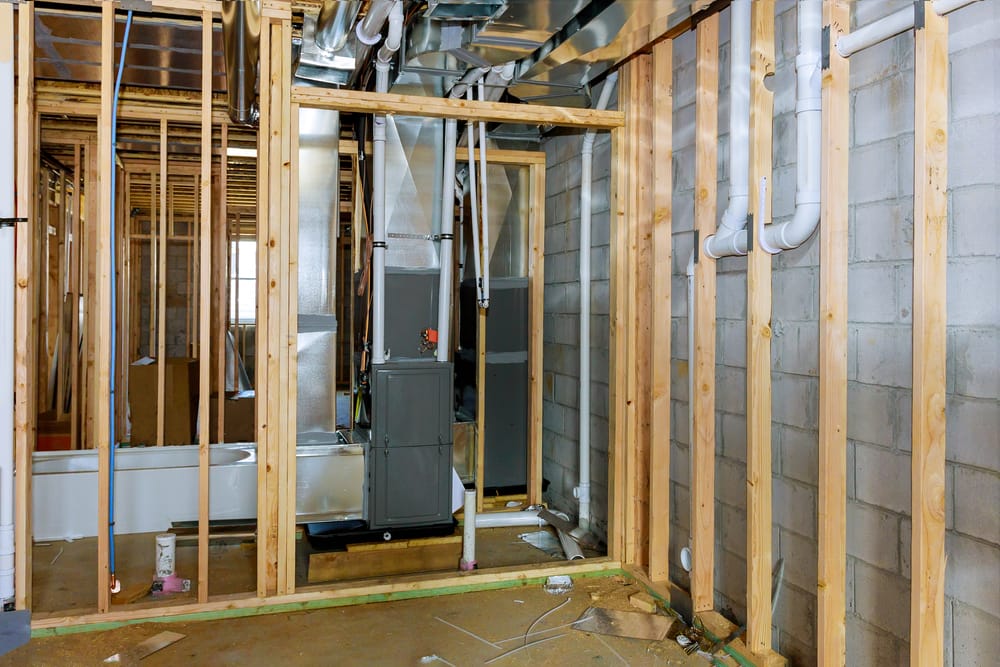 HVAC technician installing new air conditioning system at South Jersey home